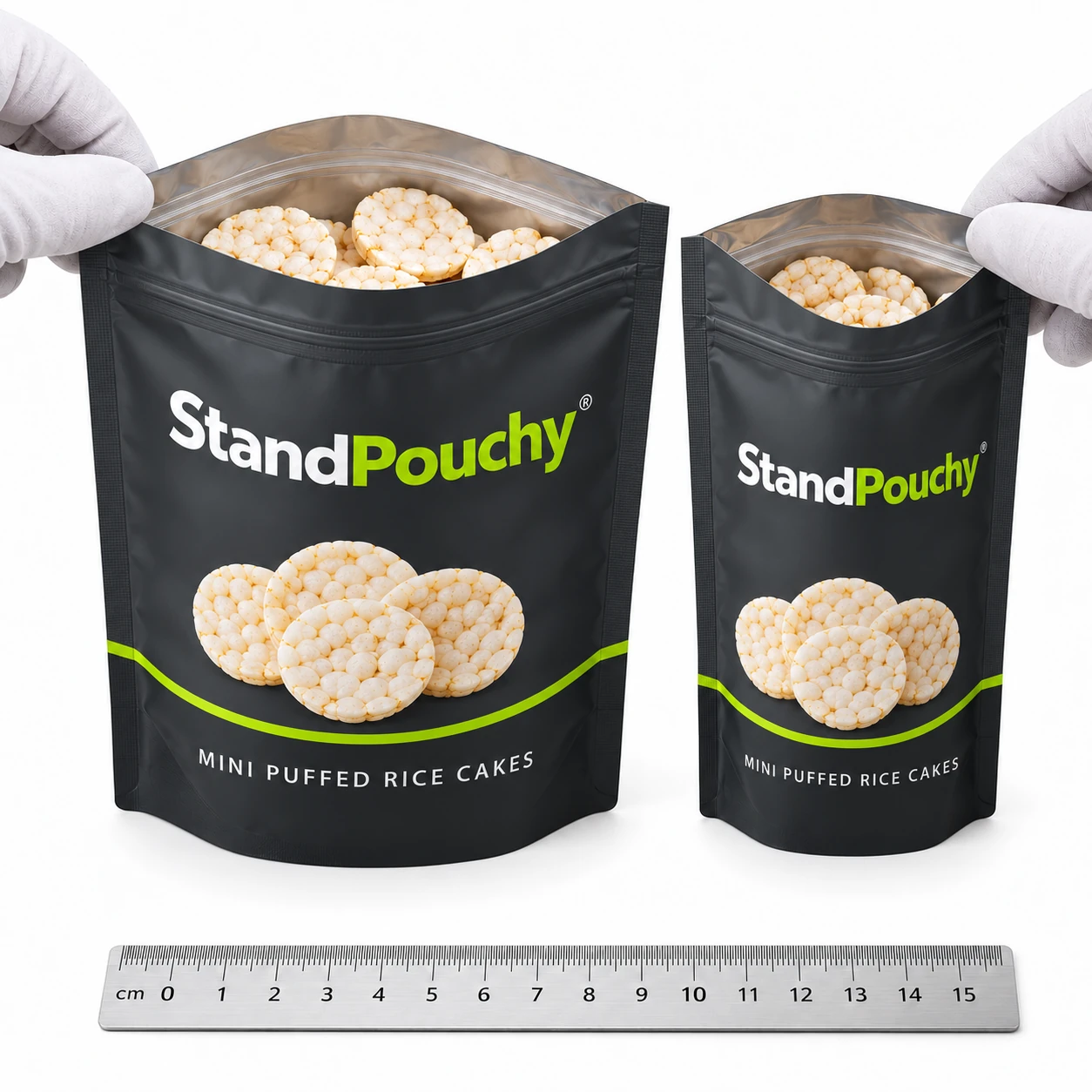 Two open rice cake pouches of different mouth widths reviewed with dry mini discs and a ruler