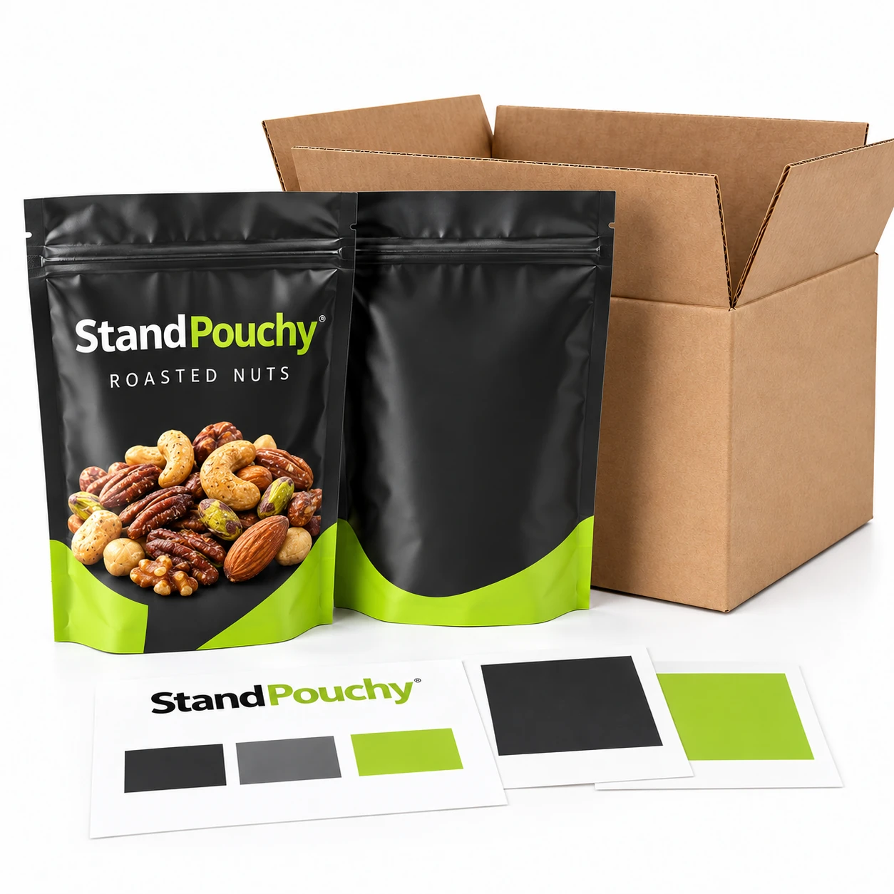 Matte and gloss charcoal snack pouches in a corrugated case beside print approval swatches