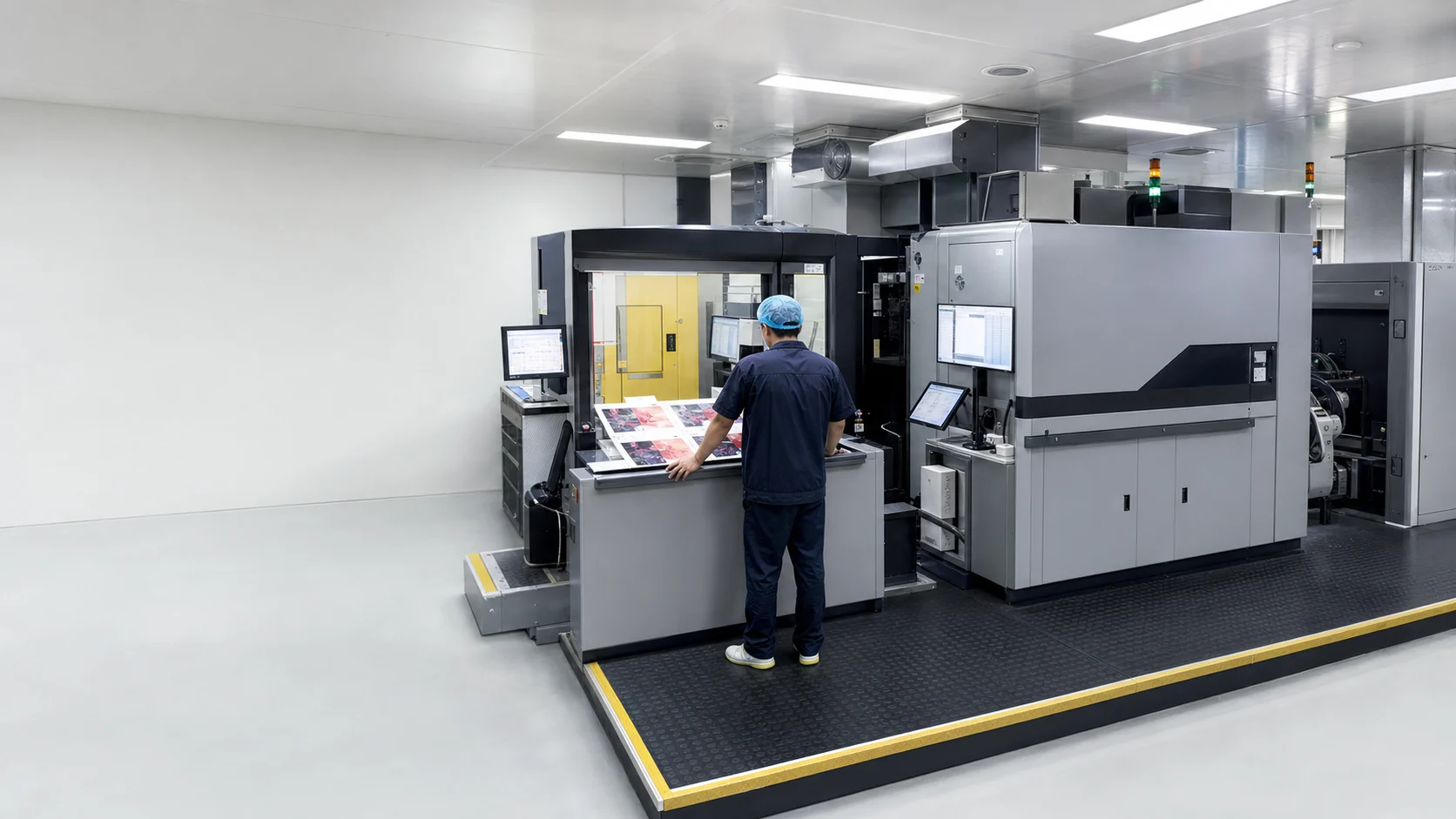 Operator working at a digital packaging printing press